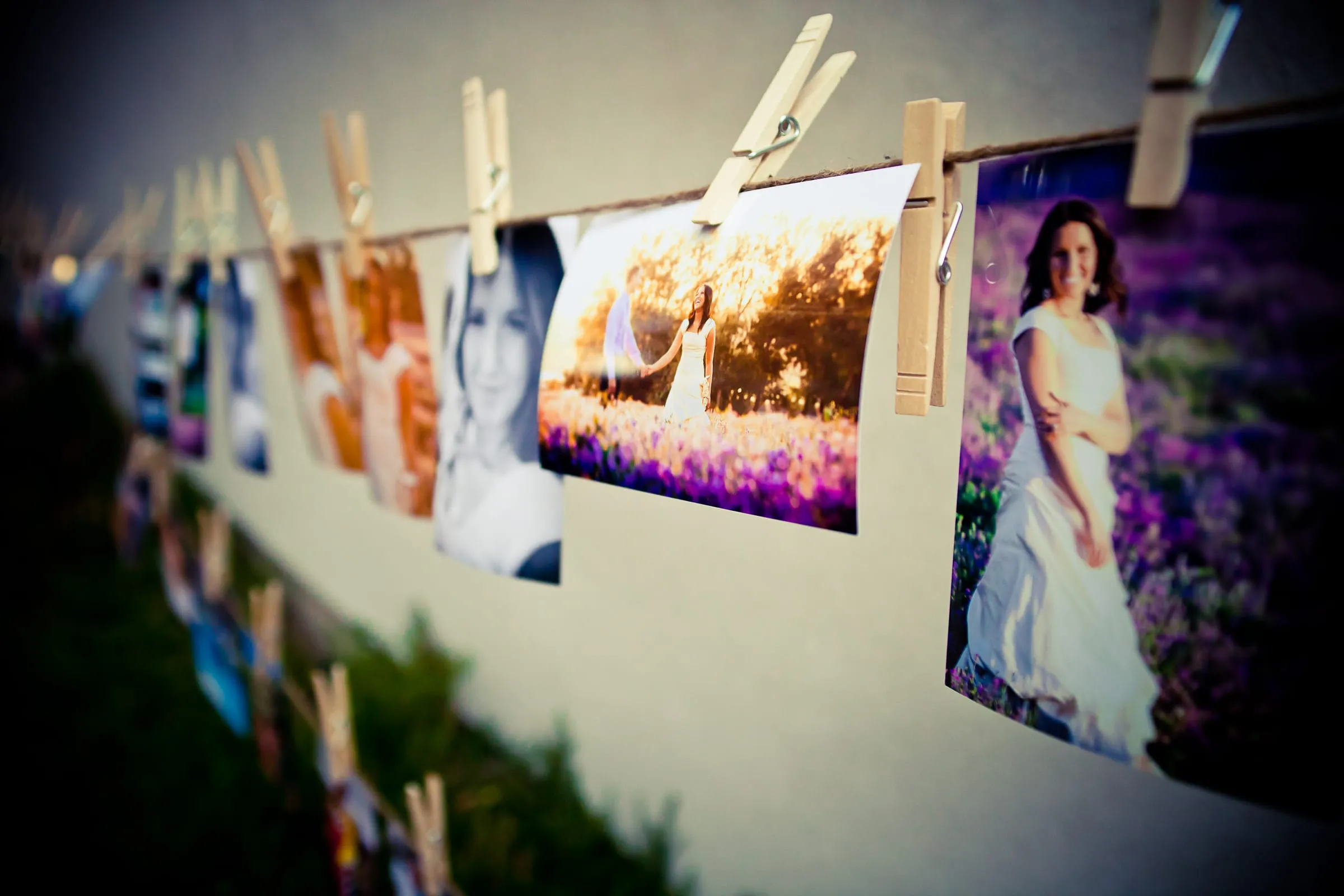 Photos of the couple pinned to a clothesline at the reception
