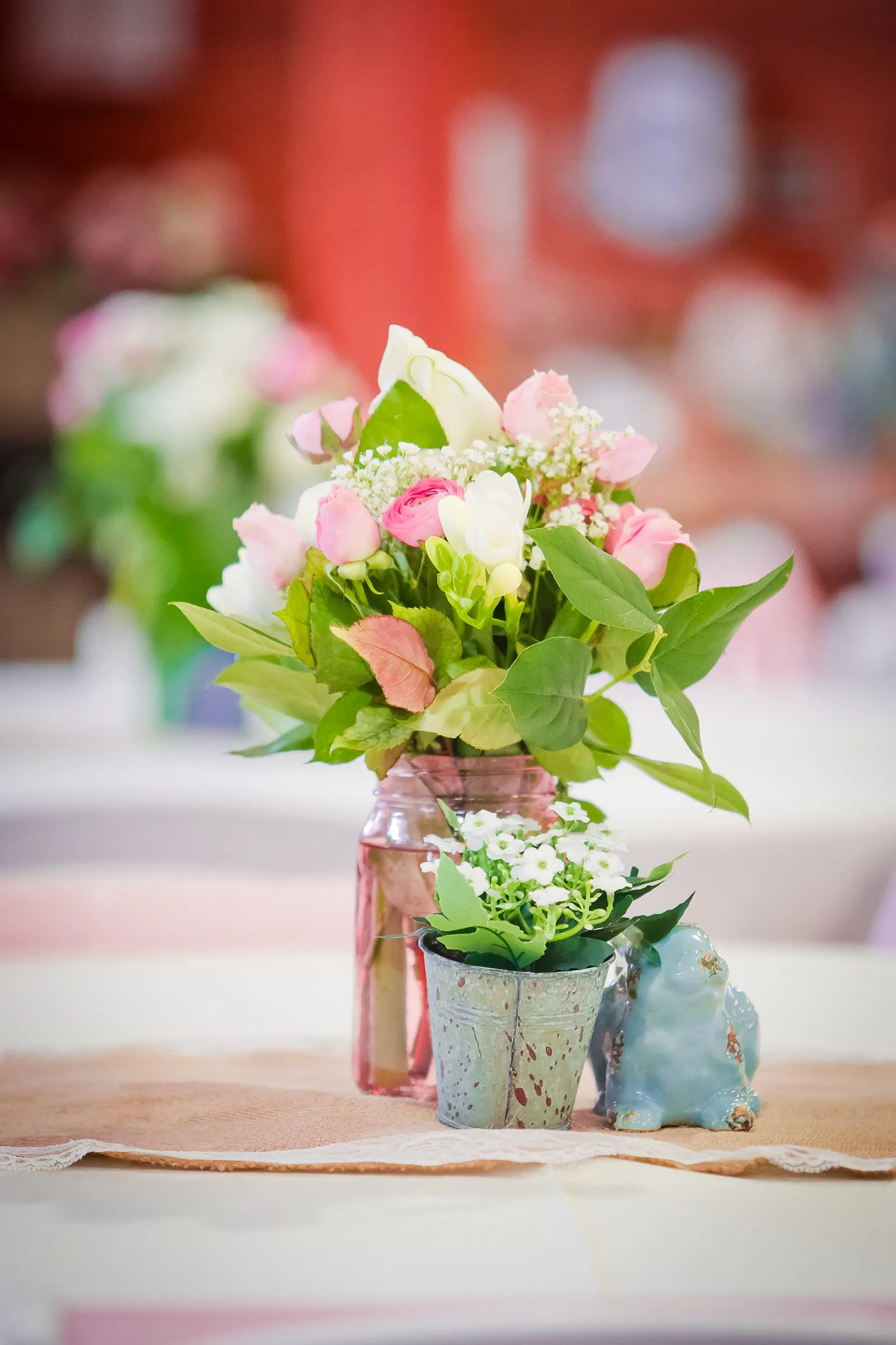 Pink and white wedding bouquet resting on a table